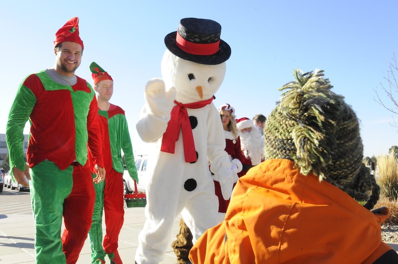 Frosty and elves greet families and children during the 2016 Candy Land Children’s Holiday Fest at Schriever Air Force Base, Colorado, Saturday, Dec. 3, 2016. Frosty and Rudolph were some of the special guests during the family festival. (U.S. Air Force photo/1st Lt. Darren Domingo)