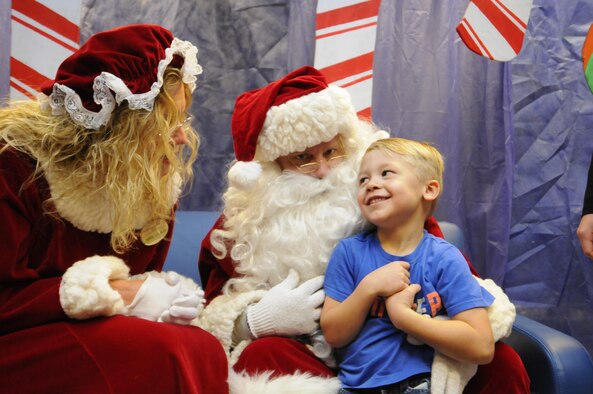 Jackson Rosenfeldt shares his Christmas wishes with Santa and Mrs. Claus during the 2016 Candy Land Children’s Holiday Fest at Schriever Air Force Base, Colorado, Saturday, Dec. 3, 2016. The free Santa experience saved families trips into town to meet Santa. (U.S. Air Force photo/1st Lt. Darren Domingo)