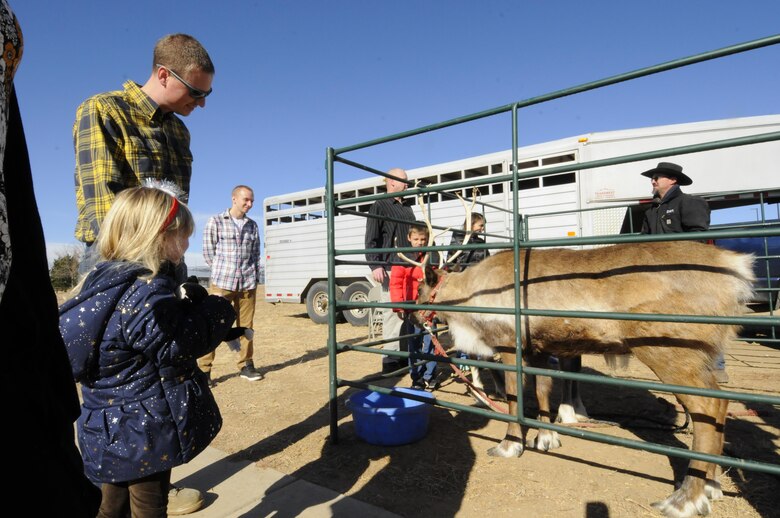 Families watch Reindeer during the 2016 Candy Land Children’s Holiday Fest at Schriever Air Force Base, Colorado, Saturday, Dec. 3, 2016. Attendees could also visit the Cheyenne Mountain Mobile ZOOMobile to meet animals at the event. (U.S. Air Force photo/1st Lt. Darren Domingo)