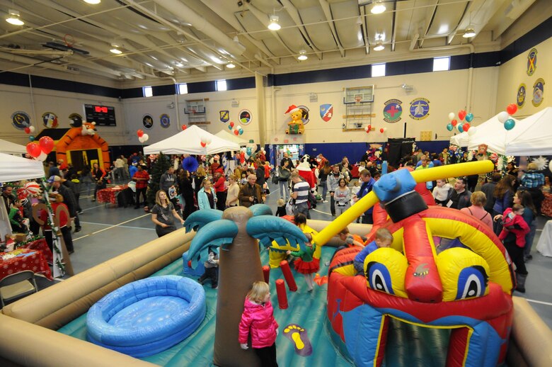 Schriever families and personnel visit informational booths and game stations during the 2016 Candy Land Children’s Holiday Fest at Schriever Air Force Base, Colorado, Saturday, Dec. 3, 2016. Approximately 1,850 attendees enjoyed the free holiday event. (U.S. Air Force photo/1st Lt. Darren Domingo)