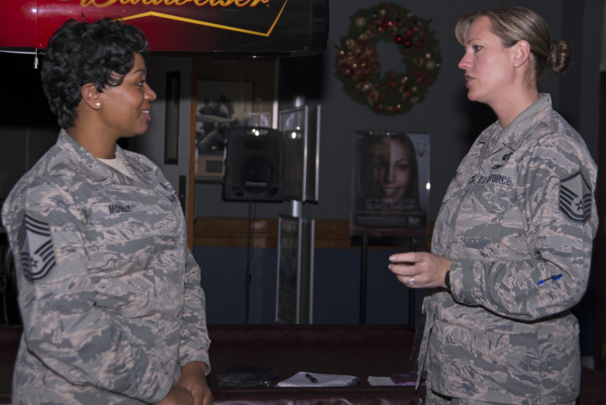 U.S. Air Force Master Sgt. Lindsey Wolf, 20th Force Support Squadron Senior Master Sgt. David B. Reid Airman Leadership School commandant, right, speaks with Chief Master Sgt. Diena Mosely, 20th Medical Group superintendent, left, about the importance of balancing home and work responsibilities during a speed networking event at Shaw Air Force Base, S.C., Dec. 1, 2016. Attendees took the opportunity to discuss what they do for Shaw as well as how they work to improve themselves personally and professionally. (U.S. Air Force photo by Airman 1st Class Kathryn R.C. Reaves)