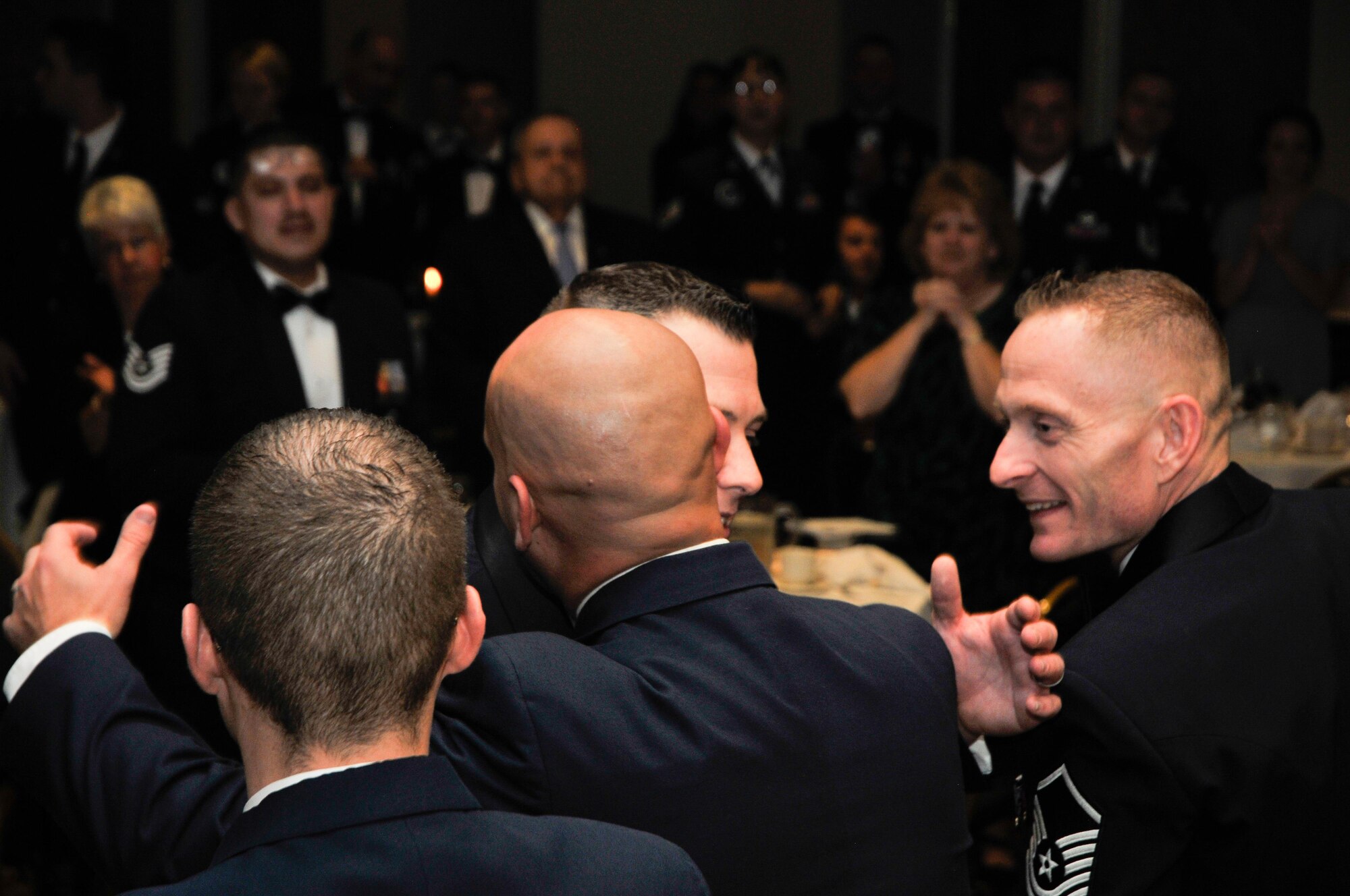 Gold Badge winner Staff Sgt. David Sumpter is congratulated by members of the 319th Recruiting Squadron during the 319th RCS Annual Banquet in Sturbridge, Massachusetts, Nov. 3. 