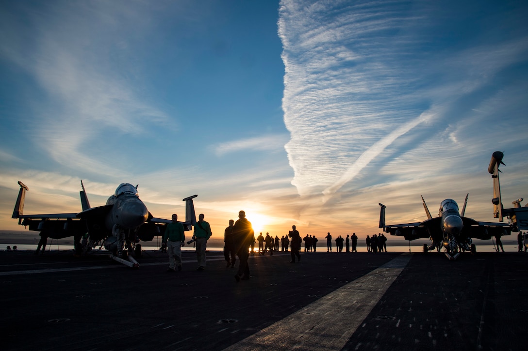 161204-N-QI061-027
SUEZ CANAL (Dec. 4, 2016) Sailors walk across the flight deck of the aircraft carrier USS Dwight D. Eisenhower (CVN 69) conducts a routine, scheduled transit through the Suez Canal. The ship and its carrier strike group are deployed in support of Operation Inherent Resolve, maritime security operations and theater security cooperation efforts in the U.S. 5th Fleet area of operations. (U.S. Navy photo by Petty Officer 3rd Class Nathan T. Beard/Released)