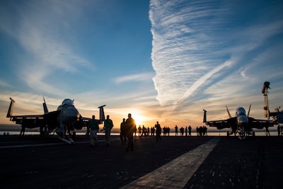 161204-N-QI061-027
SUEZ CANAL (Dec. 4, 2016) Sailors walk across the flight deck of the aircraft carrier USS Dwight D. Eisenhower (CVN 69) conducts a routine, scheduled transit through the Suez Canal. The ship and its carrier strike group are deployed in support of Operation Inherent Resolve, maritime security operations and theater security cooperation efforts in the U.S. 5th Fleet area of operations. (U.S. Navy photo by Petty Officer 3rd Class Nathan T. Beard/Released)