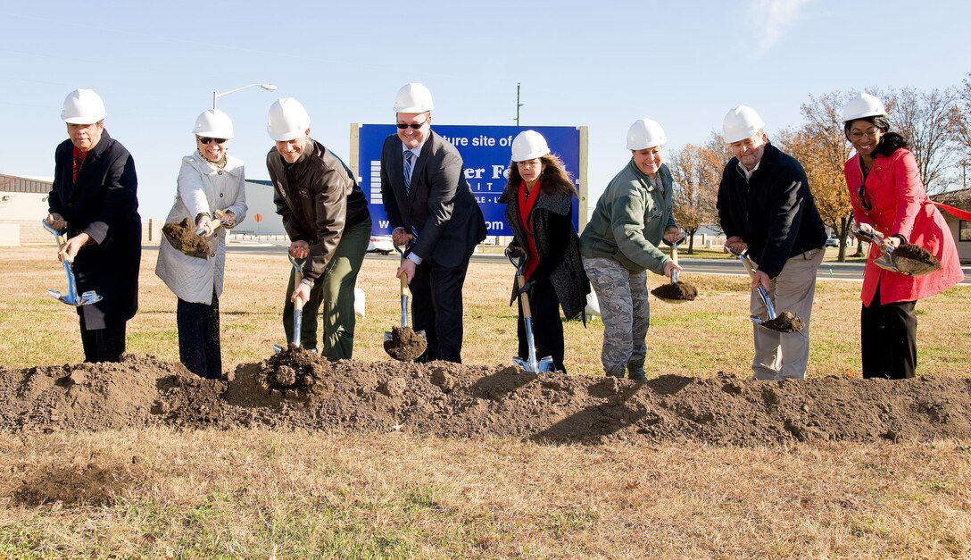 Leadership from the 436th and 512th Airlift Wings, civic and business leaders, and Dover Federal Credit Union leadership break ground for the new DFCU building at the corner of Atlantic and Evreux Streets, Dec. 2, 2016, on Dover Air Force Base, Del. Construction of the new building is scheduled to begin this month with completion projected for July 2017. Pictured left to right are Robin Christiansen, Dover, Del., mayor; Judy Diogo, Central Delaware Chamber of Commerce president; Col. Ethan Griffin, 436th Airlift Wing commander; Chaz Rzewnicki, DFCU CEO; Jeannette Schuler, DFCU board of directors chair; Col. Laura Radley, 512th Mission Support Group commander; Michael Rosaio, Commonwealth Construction Company; and Lori Walls, Crabtree, Rohrbaugh & Associates, Architects. (U.S. Air Force photo by Roland Balik)