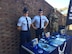 Master Sgt. Ryan Maline and Staff Sgt. Alex Smith, 317th Recruiting Squadron, set up a booth during the Military Appreciation football game at William and Mary University in Williamsburg, Virginia, Nov. 19. The event also honored 20 Delayed Entry Program members during a joint Air Force, Army DEP swear-in.