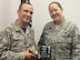 Master Sgt. Timothy Aldinger, 368th Recruiting Squadron flight chief, presents Tech. Sgt. Jordan
Lloyd with the flight’s 4th Quarter Executioner award in Taylorsville, Utah, Oct. 14. Lloyd was able to process 11 applicants in seven weeks before attending Non-Commissioned Officer Academy at Peterson Air Force Base in Colorado.