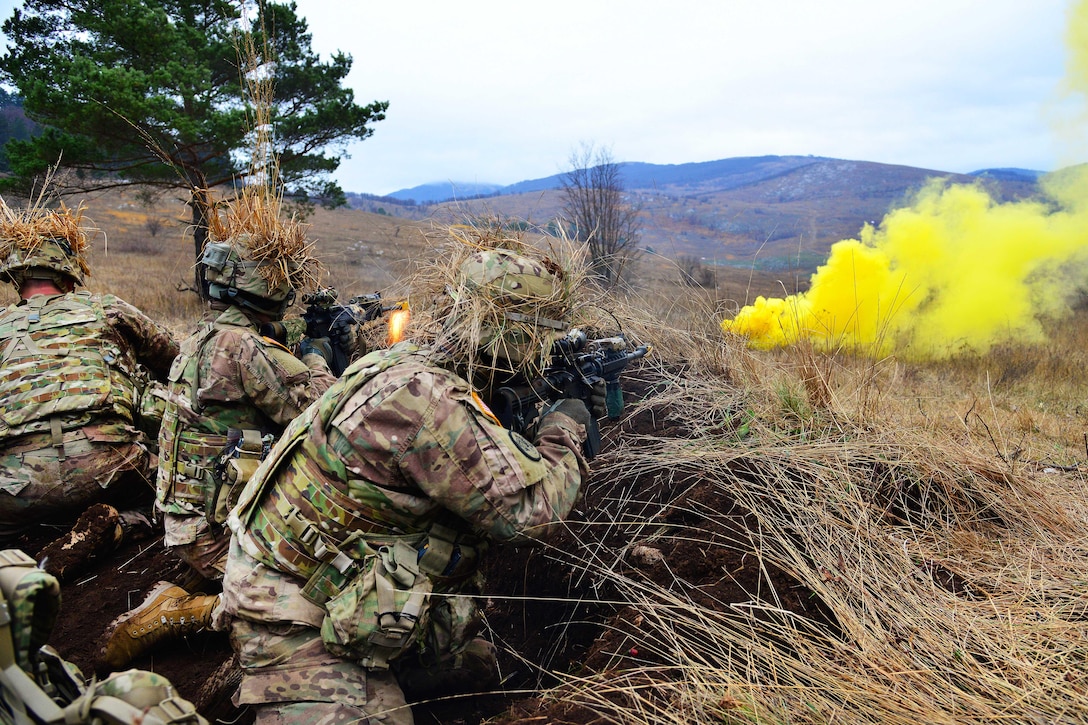 Soldiers engage targets under the cover of smoke while participating in a live-fire exercise during Exercise Mountain Shock at Pocek Range in Slovenia, Dec. 5, 2016. Army photo by Davide Dalla Massara