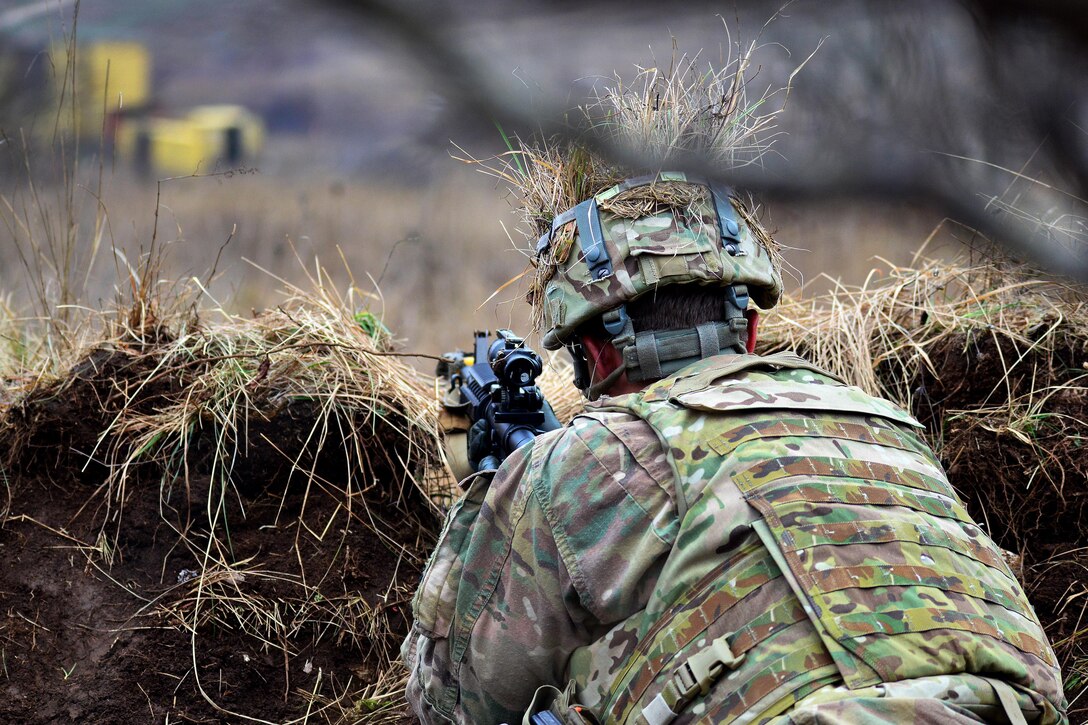 A soldier engages targets near a mock village while participating in a live-fire exercise during Exercise Mountain Shock at Pocek Range in Slovenia, Dec. 5, 2016. Army photo by Davide Dalla Massara