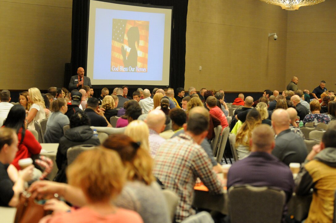 MINNEAPOLIS (December 3, 2016) – John Venner, standing left, Yellow Ribbon program director, 88th Regional Support Command, goes over the weekend schedule for the more than 500 U.S. Army Reserve Soldiers and family members attending the event that helps with the pre-, during-, and post-deployment process, December 3.