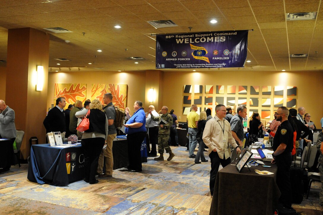 MINNEAPOLIS (December 3, 2016) – U.S. Army Reserve Soldiers and family members speak with the more than 20 different community partners that set up shop at the 88th Regional Support Command-sponsored Yellow Ribbon event, December 3. This program helps the more than 500 Soldiers and family members who attended the event by connecting them to the resources and services they might need throughout the deployment process.