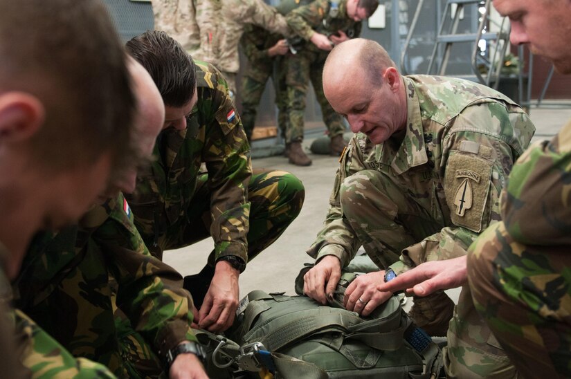 Army Master Sgt. James Roscoe representing Alpha Company, 5th Military Information Support Battalion, instructs soldiers from the Netherlands on the proper usage of MC6 and T11 equipment in preparation for Operation Toy Drop XIX. Operation Toy Drop is an annual collective training exercise used to prepare Soldiers to support the Global Combatant Commanders and Army Service Component Commanders in theaters of operation around the world. (U.S. Army Reserve Photo by Sgt. Darryl Montgomery)