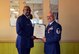 Retired Col. Willie Cooper II presents the Air Force certificate of retirement to Master Sgt. Ernesto Torres at Patrick Air Force Base, Fla., Dec. 4, 2016. Torres, a logistics planner and unit deployment manager with the 920th Maintenance Group, served in active duty and the Air Force Reserve for a total of 35 years. (U.S. Air Force photo by 1st Lt. Anna-Marie Wyant) 
