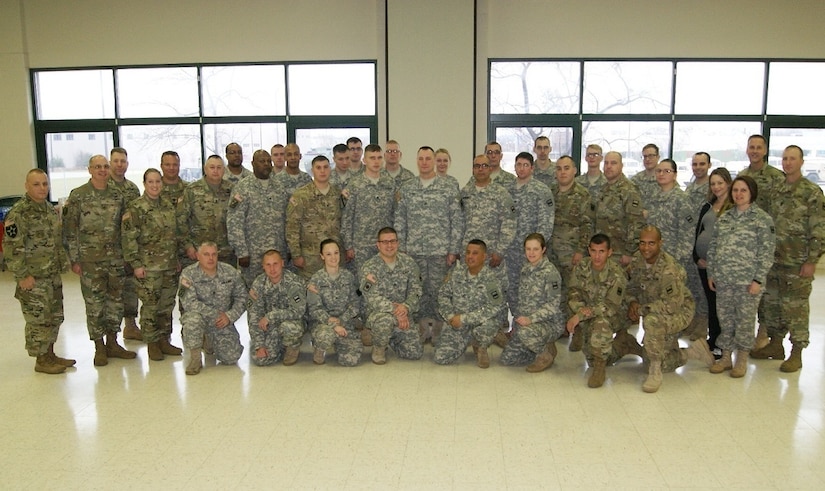 Soldiers of the 3rd Battalion, 399th Regiment pose together at their last battle assembly at the Army Reserve Center in Sturtevant, Wis., where they held their deactivation ceremony on Dec. 3, 2016.
