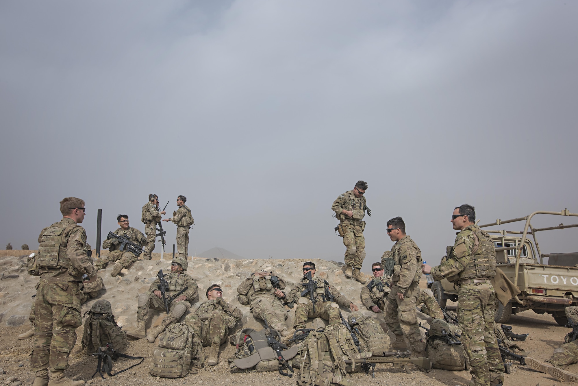 Members of Able Platoon, 1st Squadron, 3rd Cavalry Regiment, and Tech. Sgt. Jeremy Rarang, 817th Expeditionary Air Support Operations Squadron joint terminal attack controller, joke together after training Nov. 21, 2016 at Forward Operating Base Dahlke, Afghanistan. JTACs direct aircraft for use during close air support and offensive operations from a forward position. (U.S. Air Force photo by Staff Sgt. Katherine Spessa)