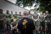 A Force Fitness Instructor gives the Physical Fitness Test brief to the students prior to conducting the first event of the course. 