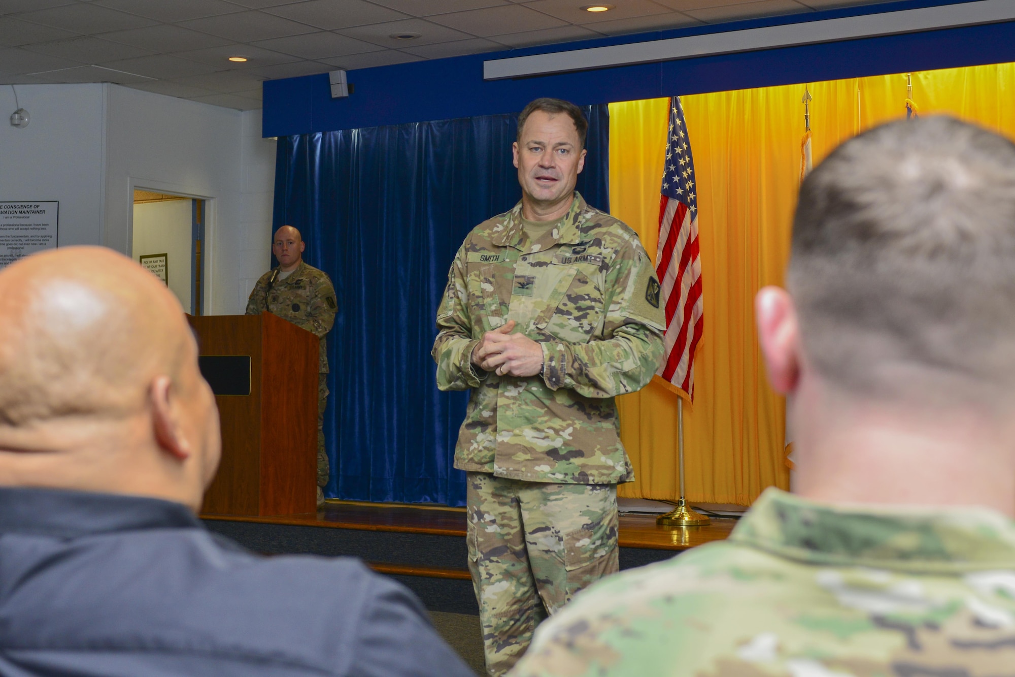 U.S. Army Col. John L. Smith, 128th Aviation Brigade commander, speaks during the brigade’s Distinguished Instructor of the Year ceremony at Joint Base Langley-Eustis, Va., Dec. 6, 2016.  The brigade recognized U.S. Army Staff Sgt. Christopher Chiodo as the Distinguished Military Instructor of the Year, and Alexander Tejada as the Distinguished Civilian Instructor of the Year. (U.S. Air Force photo by Tech. Sgt. Katie Gar Ward)
