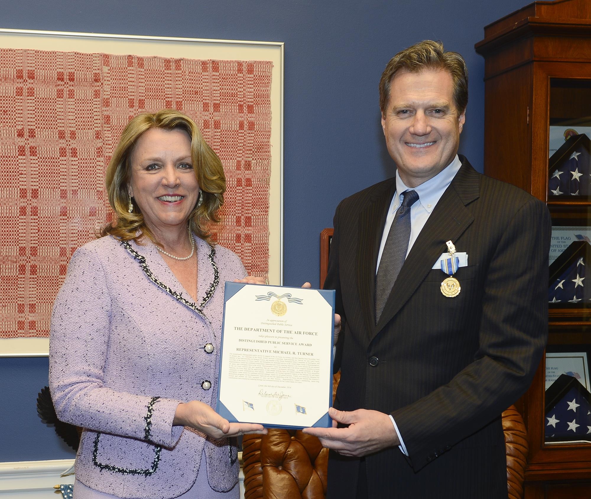 Air Force Secretary Deborah Lee James presents the Distinguished Public Service Award to U.S. Rep Michael Turner (R-OH), in Washington, D.C. Dec 6, 2016. Turner worked with fellow members of Congress to invest in Air Force mission sets and capabilities that provide America’s asymmetric advantage.  He was a key enabler of the Air Force acquisition community and focused legislative support for the National Air and Space Intelligence Center to ensure its continued strategic impact on the global mission. (U.S. Air Force photo/Andy Morataya)
