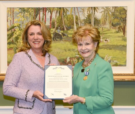 Air Force Secretary Deborah Lee James presents the Distinguished Public Service Award to U.S. Rep. Madeleine Bordallo (D-GU), in Washington, D.C. Dec 6, 2016. Bordallo’s advocacy enabled the award of a $21 billion contract for development of the B-21 Raider. (U.S. Air Force photo/Andy Morataya)
