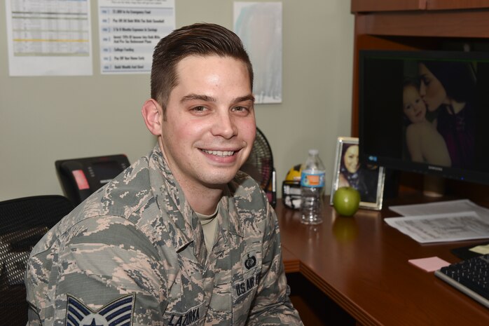 U.S. Staff Sgt. Gabriel Lazurka, financial services supervisor at the 628th Comptroller Squadron, poses at his desk Nov. 30, 2016, at Joint Base Charleston, South Carolina. Lazurka was accepted into the Commissioned Officer Training program for healthcare. COT is a five-week program designed to transition Airmen and civilians into the U.S. Air Force commissioned officers corps. 