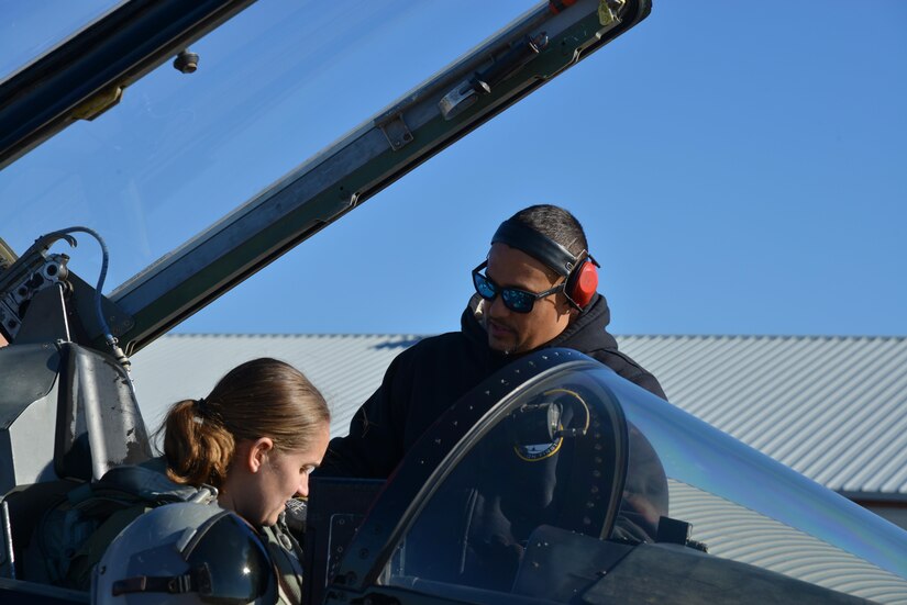 Orlando Vasquez, Mission 1st Support Services contractor, performs pre-flight checks with U.S. Air Force Capt. Chelsea Bailey, 71st Fighter Training Squadron T-38 Talon adversary air mission commander, at Joint Base Langley-Eustis, Va., Dec. 6, 2016. The Mission 1st Support Services’ mission is to prepare and maintain the T-38s for flight. (U.S. Air Force photo by Airman 1st Class Tristan Biese)