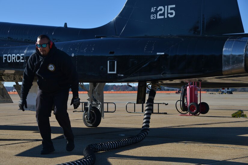 Orlando Vasquez, Mission 1st Support Services contractor, runs through pre-launch procedures at Joint Base Langley-Eustis, Va., Dec. 6, 2016. The procedures include checking flight controls, gauges and pumping air into the aircraft to start the engine. (U.S. Air Force photo by Airman 1st Class Tristan Biese) 