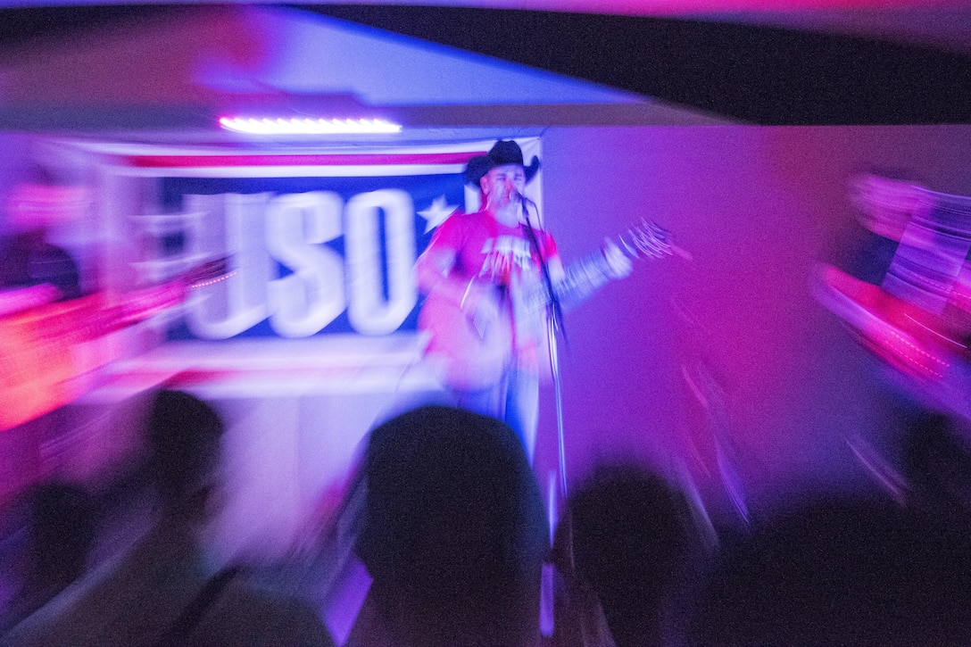 Country music singer Craig Campbell performs for service members during the USO Holiday Tour at Al-Udeid Air Base, Qatar, Dec. 6, 2016. DoD photo by Navy Petty Officer 2nd Class Dominique A. Pineiro