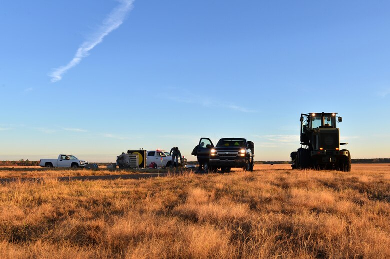 U.S. Airmen assigned to the 20th Civil Engineer Squadron power production flight assemble at a Barrier Artillery Kit-12 rotary friction brake aircraft arresting system site at Shaw Air Force Base, S.C., Dec. 3, 2016. BAK-12s must be replaced every 10 years to ensure the engine and gears work effectively. (U.S. Air Force photo by Airman 1st Class Christopher Maldonado) 