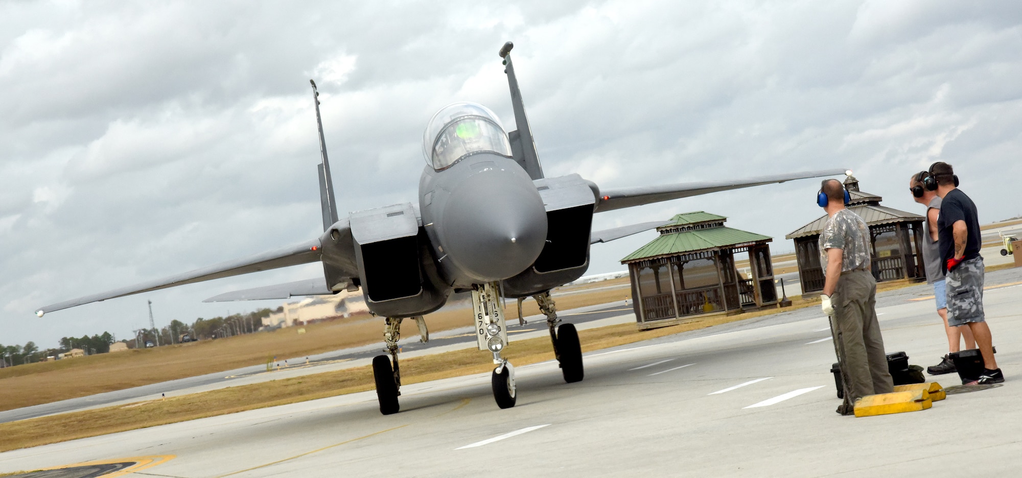 Col. Christopher Sage, 4th Fighter Wing commander taxis his F-15 Strike Eagle from Seymour Johnson Air Force Base, North Carolina, onto the flight line at Robins Air Force Base. Sage brought the F-15 to Robins for Programmed  Depot Maintenance. (U.S. Air Force photo by Ed Aspera)