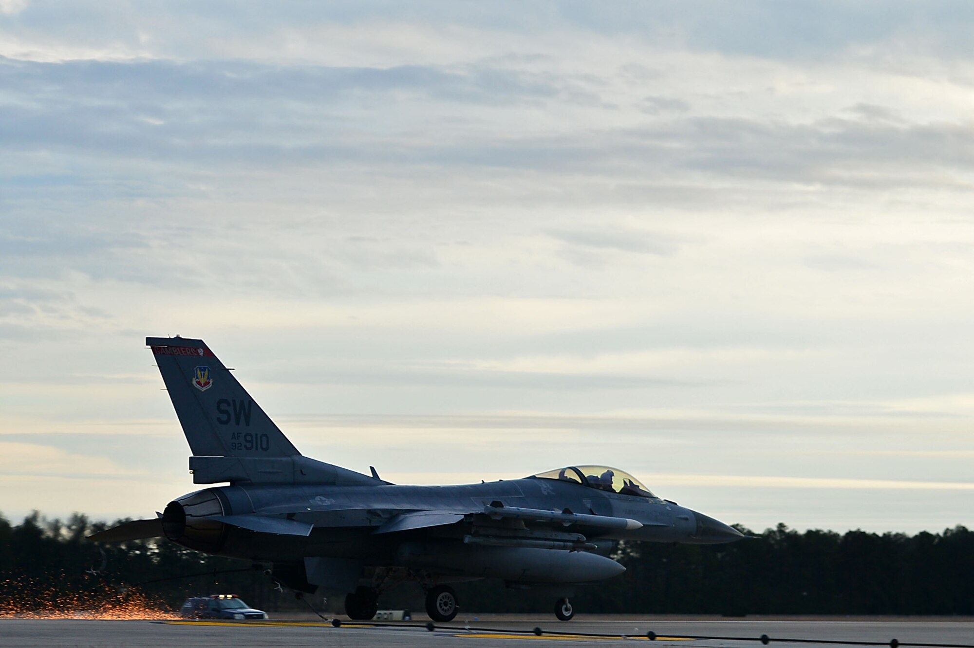 An F-16CM Fighting Falcon assigned to the 77th Fighter Squadron latches onto a Barrier Artillery Kit-12 rotary friction brake aircraft arresting system at Shaw Air Force Base, S.C., Dec. 3, 2016. The arresting systems are tested annually to ensure proper functionality when halting an aircraft in distress. (U.S. Air Force photo by Airman 1st Class Christopher Maldonado)