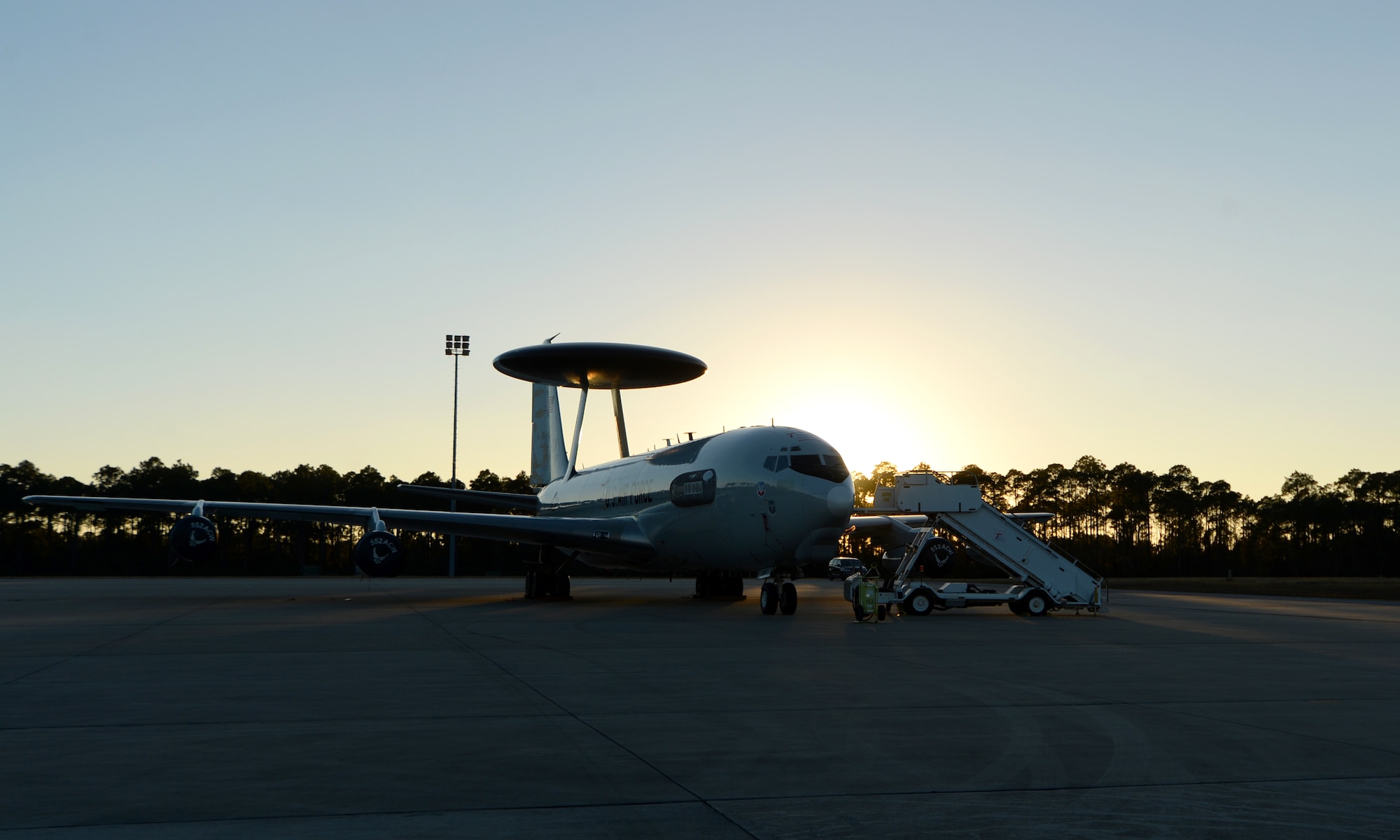 A U.S. Air Force E-3 Sentry Airborne Warning and Control System from 552nd Air Control Wing, Tinker Air Force Base, Okla., sits as the sun sets over the flightline at Tyndall Air Force Base, Fla., Dec. 6, 2016. The AWACS is at Tyndall in support of concurrent aerial exercises Checkered Flag 17-1 and Combat Archer 17-3 that runs Dec. 5-16. (U.S. Air Force photo by Airman 1st Class Isaiah J. Soliz/Released)