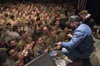 Scarlett Johansson and Chris Evans sign autographs for service members during the USO Holiday Tour at Incirlik Air Base, Dec. 5, 2016. Marine Gen. Joseph F. Dunford, Jr., chairman of the Joint Chiefs of Staff, and USO entertainers, will visit service members who are deployed from home during the holidays at various locations across the globe. This year’s entertainers included actor Chris Evans, actress Scarlett Johansson, NBA Legend Ray Allen, 4-time Olympic Medalist Maya DiRado, Country Music Singer Craig Campbell, and mentalist Jim Karol. (DoD photo by Navy Petty Officer 2nd Class Dominique A. Pineiro)