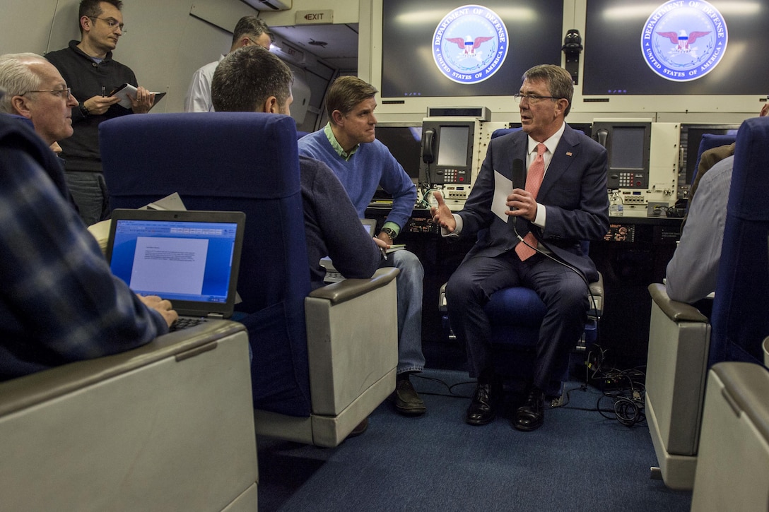 Defense Secretary Ash Carter speaks with reporters aboard an Air Force E4-B aircraft as he flies to Brussels, Feb. 9, 2016, to attend NATO meetings for defense ministers to discuss Russian aggression and accelerating the fight against ISIL. DoD photo by Air Force Senior Master Sgt. Adrian Cadiz