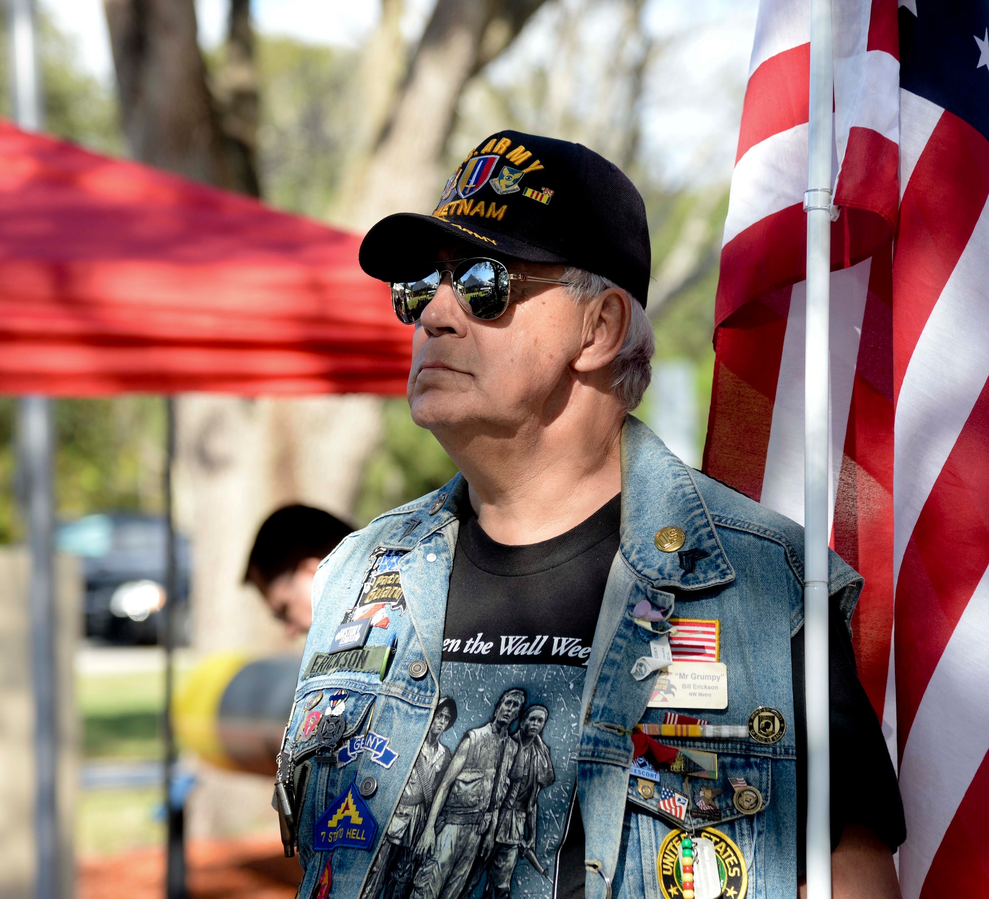 Army veteran Bill Erickson, holds a flag during the Pearl Harbor Remembrance Day ceremony at Veterans Memorial Park in Tampa, Fla., Dec. 7, 2016. Service members, veterans, retirees and civilians gathered to commemorate the 75th anniversary with a ceremony themed “We Remember the Fallen.” (U.S. Air Force photo by Senior Airman Vernon L. Fowler Jr.)