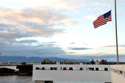 USS Utah survivor Gilbert Meyer (second from far right) stands aboard the USS Utah Memorial during a sunset service on Ford Island, Dec. 6, 2016. Navy Region Hawaii hosted the event to remember those who served aboard the Florida-class battleship and to honor the 58 crew members still entombed aboard the sunken vessel. Dec. 7, 2016 marks the 75th anniversary of the attacks on Pearl Harbor and Oahu. The U.S. military and the State of Hawaii are hosting a series of remembrance events throughout the week to honor the courage and sacrifices of those who served Dec. 7, 1941 and throughout the Pacific theater. As a Pacific nation, the U.S. is committed to continue its responsibility of protecting the Pacific sea-lanes, advancing international ideals and relationships, well as delivering security, influence and responsiveness in the region.