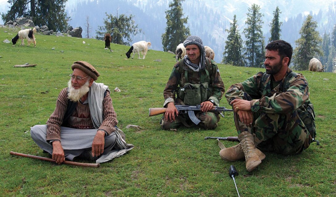 Humble Beginnings: ANA soldiers sit in Kunar Province, home of the tree army, a militant organization that began their journey with little resources and have become a self-sustaining resistance group with the common goal of eliminating the Taliban.