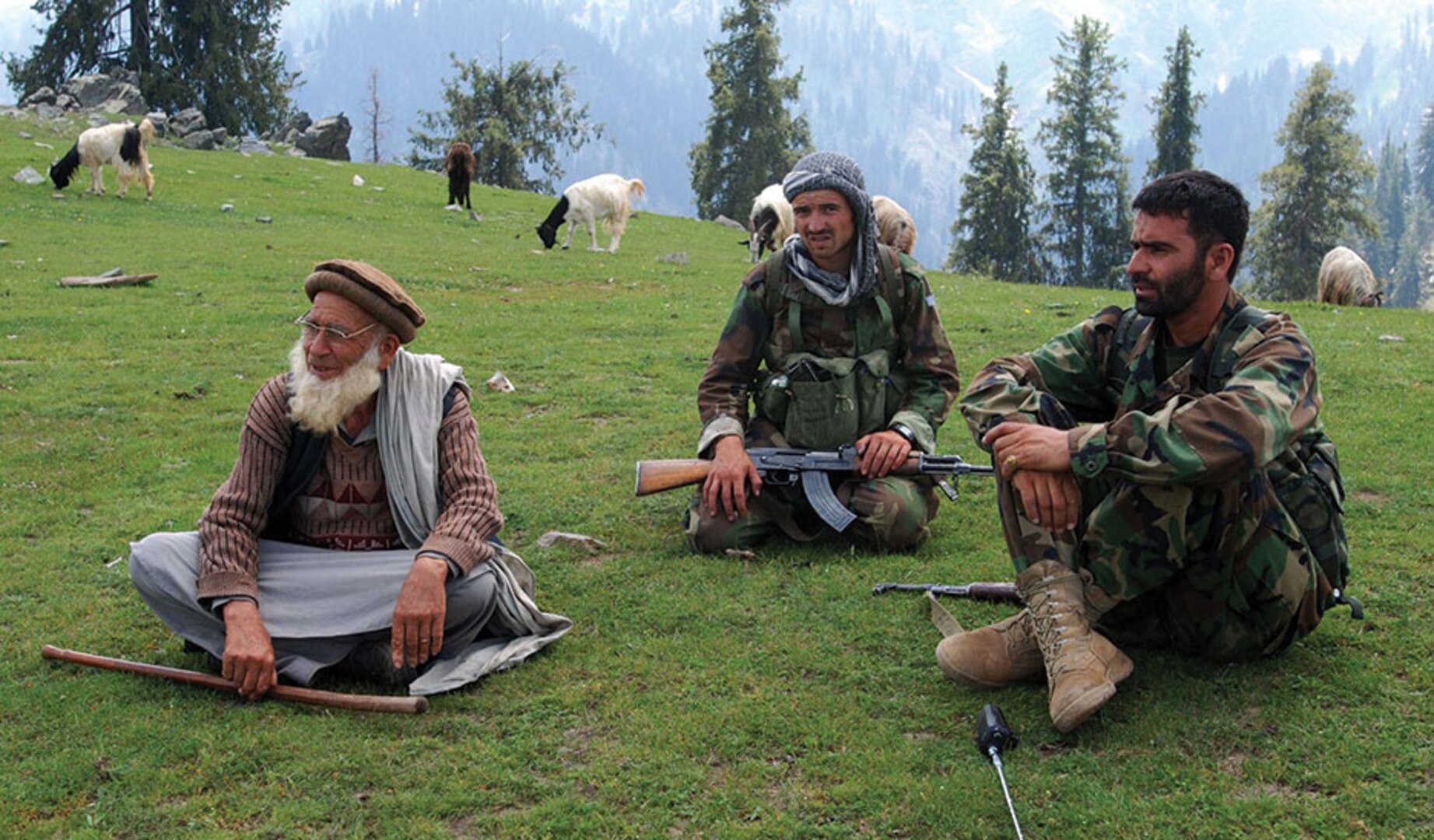 Humble Beginnings: ANA soldiers sit in Kunar Province, home of the tree army, a militant organization that began their journey with little resources and have become a self-sustaining resistance group with the common goal of eliminating the Taliban.