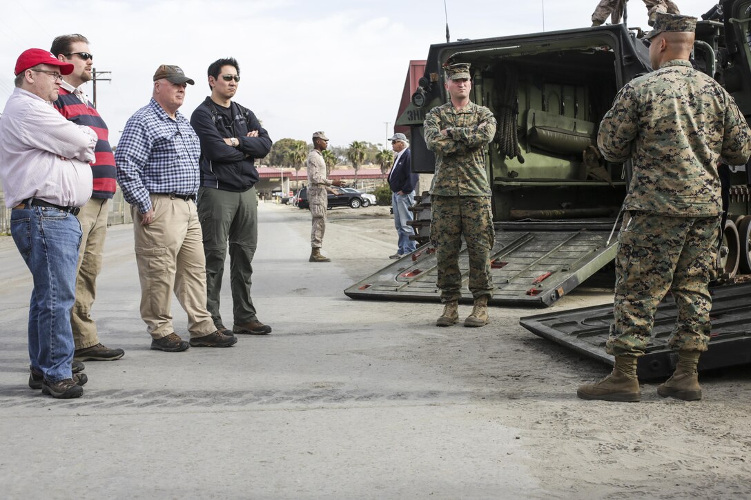 Staff Sgt. Cromwell Downs, vehicle maintenance chief, 3rd Assault Amphibian Battalion, 1st Marine Division, explains the capabilities of the assault amphibious vehicle to Defense Advanced Research Projects Agency scientists on Camp Pendleton, Calif., Dec. 5. 2016. DARPA assists the Marine Corps in improving technology and medicine to overcome challenges on future battlefields. 