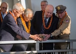 (Left to right) Shiro Wakita, former WWII Imperial Japanese Navy pilot; Dr. Hiroya Sugano M.D, director general of the Zero Fighter Admirers Club; Jack Detour, former colonel and World War II Army Air Force B-25 pilot; Jerry Yellin, former captain and WWII Army Air Force P-51 pilot, pour bourbon whiskey at the 6th annual Blackened Canteen Ceremony at the USS Arizona Memorial during the 75th commemoration of the attacks on Pearl Harbor, Dec. 6, 2016. The blackened canteen is a relic of an air raid over Shizauoka, Japan in 1945. It is used for pouring bourbon whiskey as an offering to the fallen in the hallowed waters of Pearl Harbor. Dec. 7, 2016 marks the 75th anniversary of the attacks on Pearl Harbor and Oahu. Since Dec. 7, 1941, the U.S. and Japan have endured more than 70 years of continued peace, a cornerstone of security and prosperity in the Indo-Asia-Pacific region. As a Pacific nation, the U.S. is committed to continue its responsibility of protecting the Pacific sea-lanes, advancing international ideals and relationships, well as delivering security, influence and responsiveness in the region. 