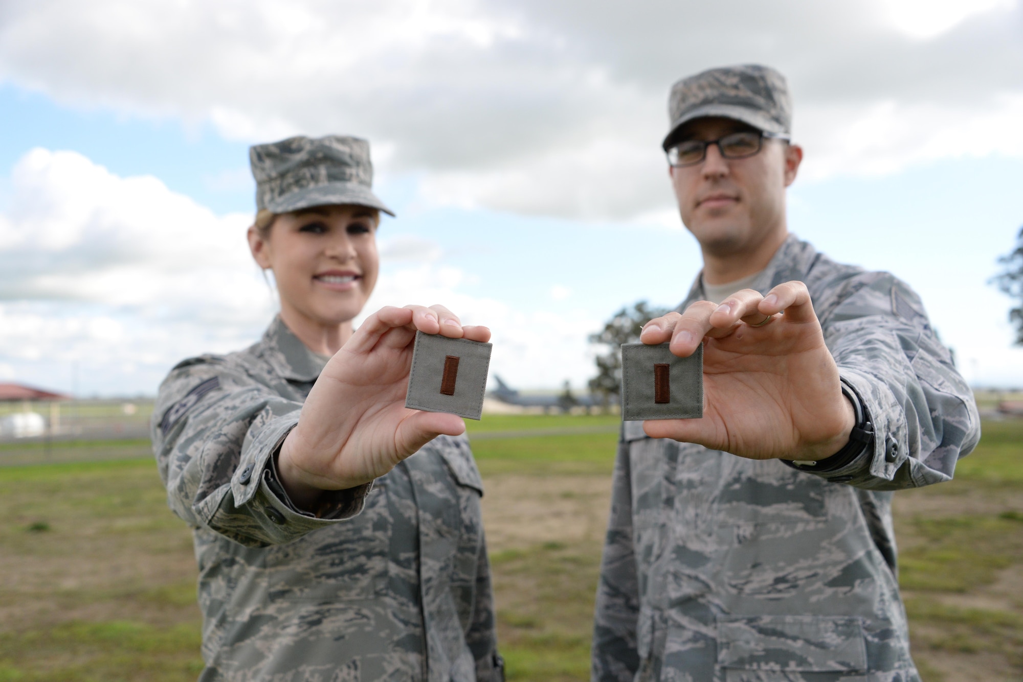 Staff Sgt. Katherine Little and Tech Sgt. Maurice Morrell, both part of the 60th Air Mobility Wing Comptroller Squadron, proudly display their future second lieutenant ranks at Travis Air Force Base, Calif. Little and Morrell were each selected for Officer Training School and will commission at the end of their OTS classes in January and March, respectively. (U.S. Air Force photo by 2nd Lt. Sarah Johnson)