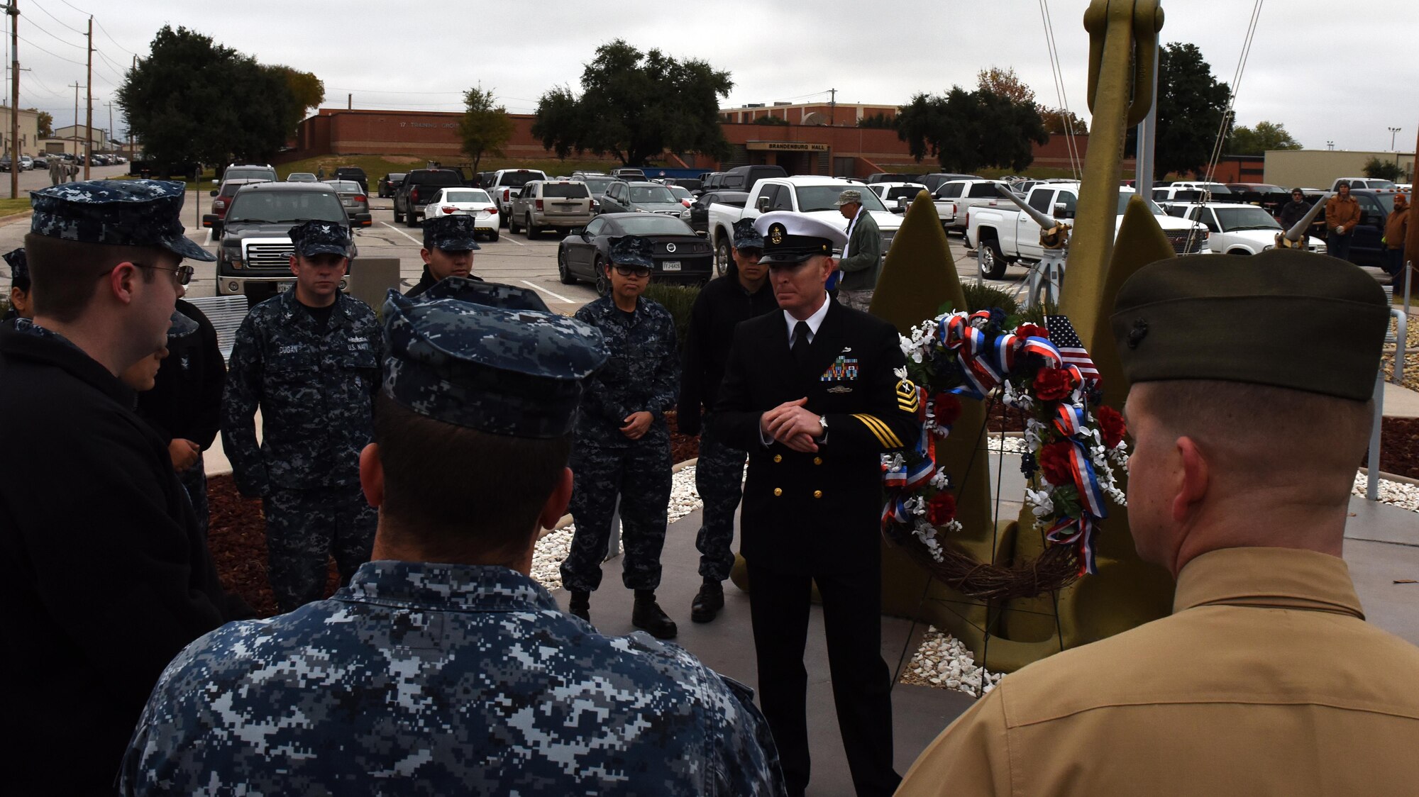 U.S. Navy Chief Petty Officer Shane Tuttle, Navy Center for Information Warfare Training Detachment Goodfellow assistant officer in charge, delivers a speech after the 75th Pearl Harbor remembrance ceremony at Liberty Park on Goodfellow Air Force Base, Texas, Dec. 7, 2016. He asked sailors in training what they knew about the Pearl Harbor attack and spoke of how it relates to their training today. (U.S. Air Force photo by Airman 1st Class Caelynn Ferguson/Released)