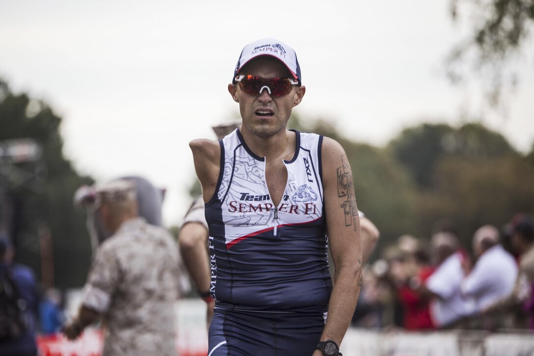 A runner reaches the finish line of the 41st Marine Corps Marathon in Washington, D.C., Oct. 30, 2016. More than 30,000 participants, volunteers and spectators flooded the city for the race. Marine Corps photo by Lance Cpl. Dana Beesley