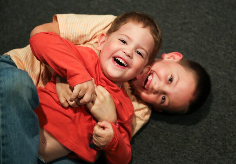 Sgt. Robert Newborg’s children play after receiving the Military Family of the Quarter award in Havelock, N.C., Oct. 25, 2016. The award is given to the military family that has most positively impacted the local community over the past quarter. The Newborg’s donated and volunteered time and energy to the community by working with organizations such as the Knights of Columbus and a local elementary school. Newborg is a cryptologic equipment instructor at the Center of Naval Aviation Technical Training aboard Marine Corps Air Station Cherry Point, N.C. (U.S. Marine Corps photo by Lance Cpl. Cody Lemons/Released)

