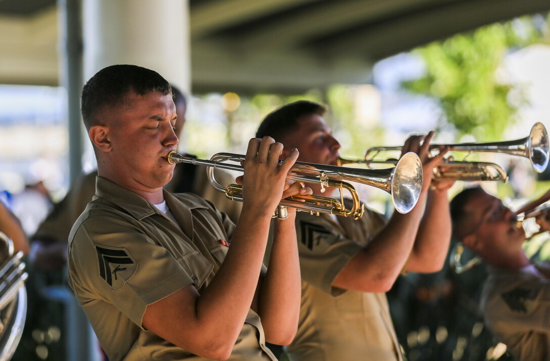 U.S. Marine Cpl. TyAustin Walker, musician, U.S. Marine Corps Forces, Pacific Band performs for veterans and civilians at the USS Arizona Memorial Visitor Center, Hawaii, Dec. 6, 2016. The concert was held for civilian and military members visiting the memorial. The U.S. military, National Park Service, and State of Hawaii are jointly commemorating the 75th anniversary of the Dec. 7, 1941 attacks on Pearl Harbor and Oahu. (U.S. Marine Corps photo by Cpl. Wesley Timm/Released)