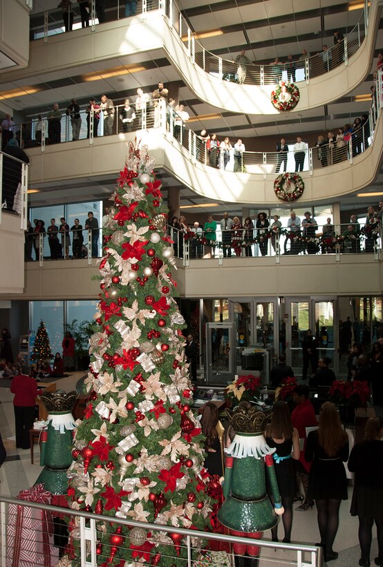 More than 200 McNamara Headquarters Complex employees gather in the atrium and along the rails of top floors to watch the annual tree lighting ceremony Dec. 7.