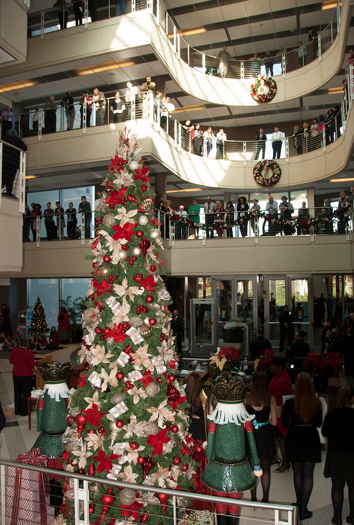 More than 200 McNamara Headquarters Complex employees gather in the atrium and along the rails of top floors to watch the annual tree lighting ceremony Dec. 7.