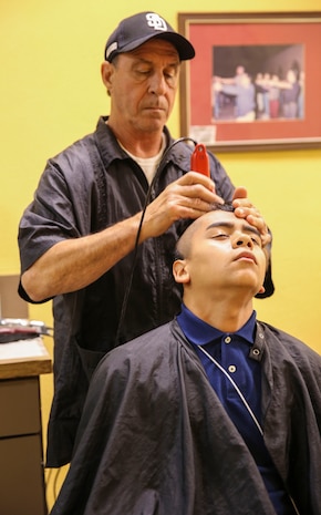 A recruit from Delta Company, 1st Recruit Training Battalion, receive their initial haircut at Marine Corps Recruit Depot San Diego, Dec. 5. Recruits receive haircuts immediately after arriving to create uniformity. Annually, more than 17,000 males recruited from the Western Recruiting Region are trained at MCRD San Diego. Delta Company is scheduled to graduate March 3.
