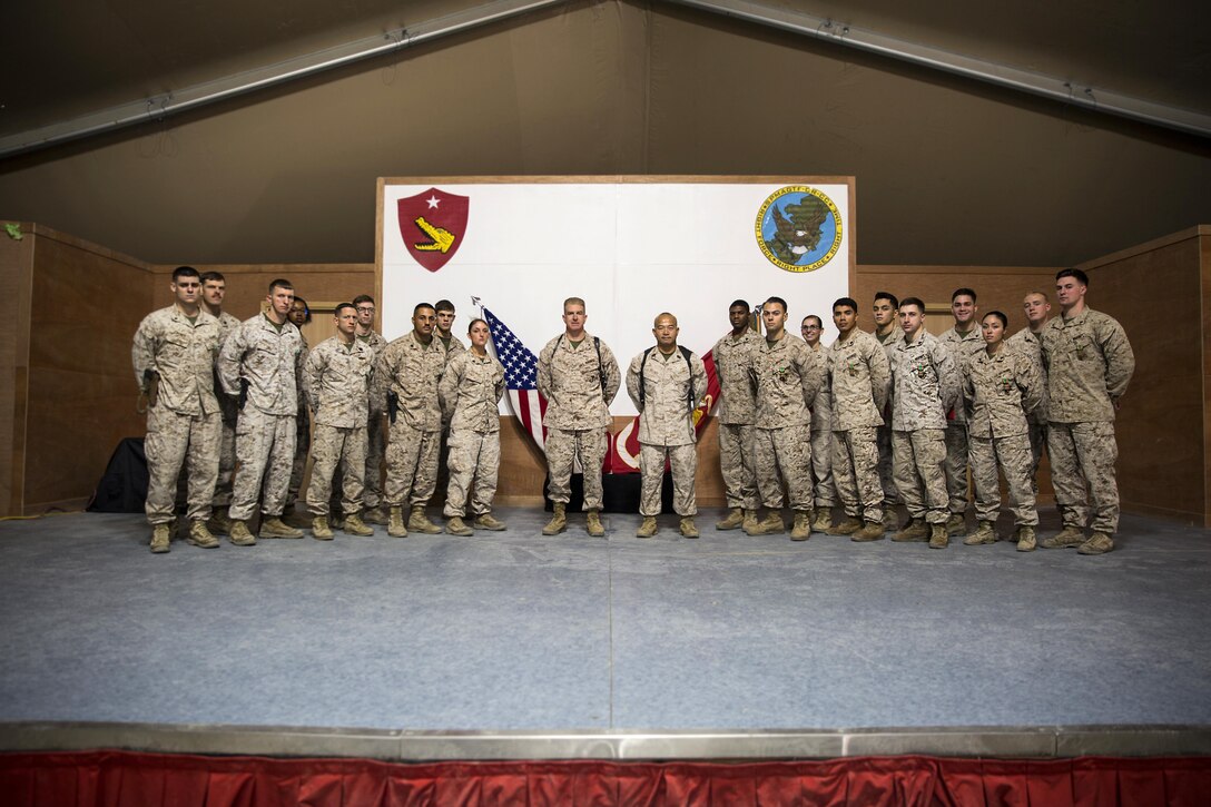 U. S. Marines with Special Purpose Marine Air-Ground Task Force – Crisis Response – Central Command were awarded during a town hall brief while forward deployed Dec. 4, 2016. The Marines have been conducting various missions in support of Operation Inherent Resolve, to include the building of intelligence support packages leading to kinetic airstrikes against Islamic State of Iraq and the Levant targets; upgrading communications capabilities between SPMAGTF and special operating forces in the AOR and conducting theater security cooperation training exercises with partner nations. SPMAGTF-CR-CC is a self-sustaining expeditionary unit, designed to provide a broad range of crisis response capabilities throughout the Central Command area of responsibility, using organic aviation, logistical and ground combat assets, to include embassy reinforcement and tactical recovery of aircraft and personnel.