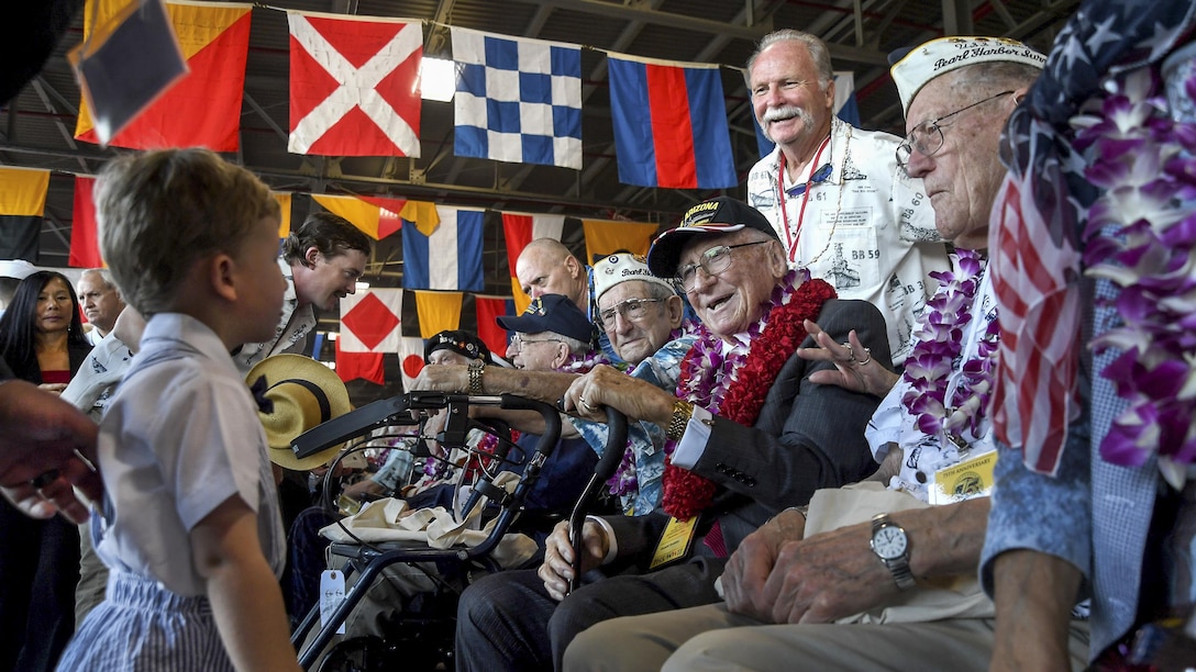 <strong>Photo of the Day: Dec. 8, 2016</strong><br/><br />Pearl Harbor survivors greet a child during the 75th commemoration of the attacks on Pearl Harbor at Pearl Harbor, Hawaii, Dec. 7, 2016. The U.S. military co-hosted the event, which provided veterans, family members, service members and the community a chance to honor the sacrifices made by those who were present during the attacks. Navy photo by Petty Officer 2nd Class Laurie Dexter<br/><br /><a href="http://www.defense.gov/Media/Photo-Gallery?igcategory=Photo%20of%20the%20Day"> Click here to see more Photos of the Day. </a> 