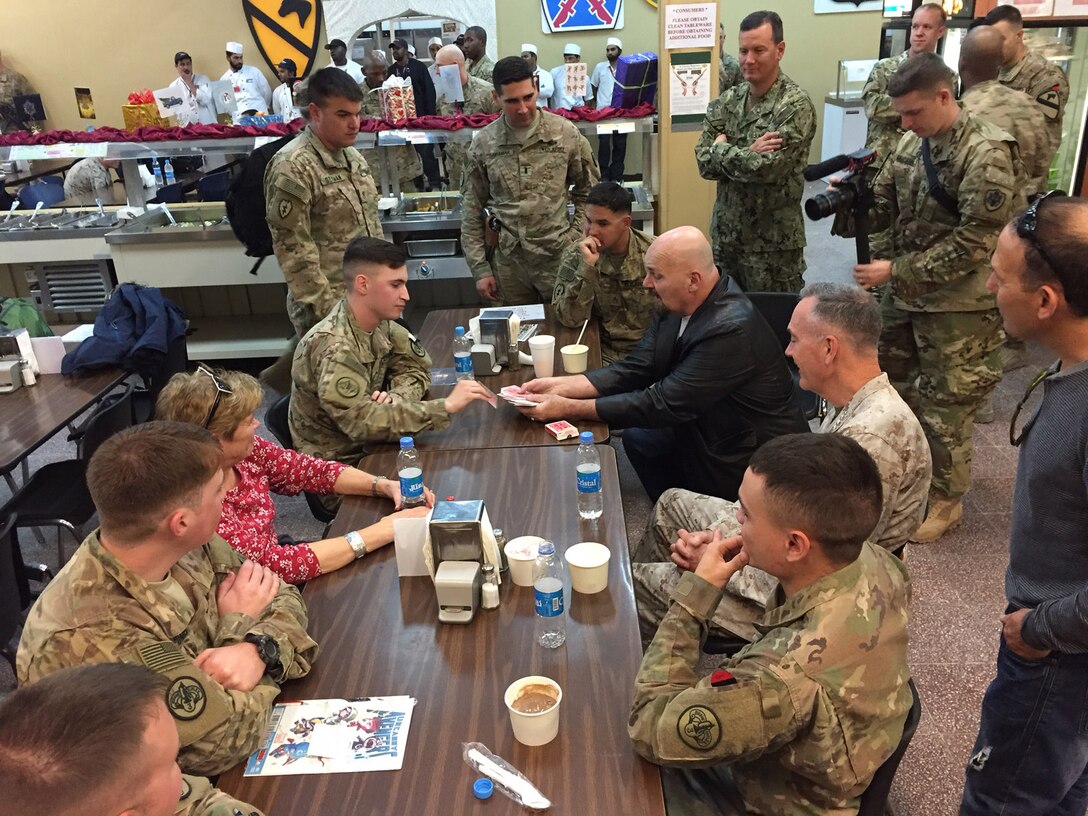 Marine Corps Gen. Joe Dunford, chairman of the Joint Chiefs of Staff, watches as mentalist Jim Karol entertains service members at Bagram Airfield, Afghanistan, Dec. 7, 2016. Dunford is leading a USO tour featuring entertainers and athletes to bring a bit of home to deployed troops. DoD photo by Jim Garamone